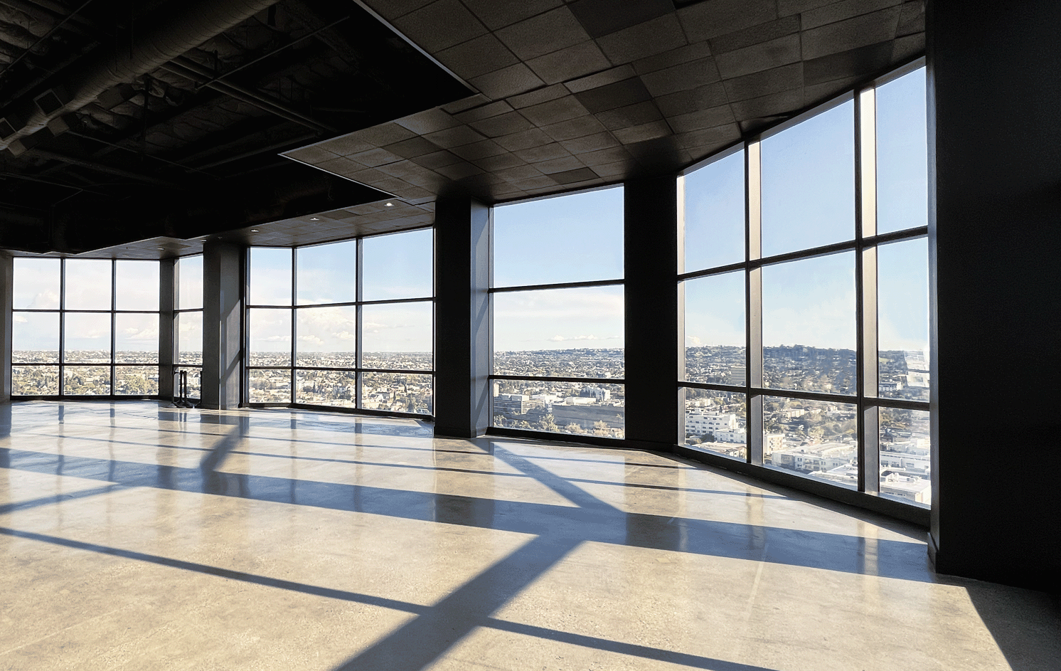 Panoramic floor-to-ceiling windows at Skyla with LA views